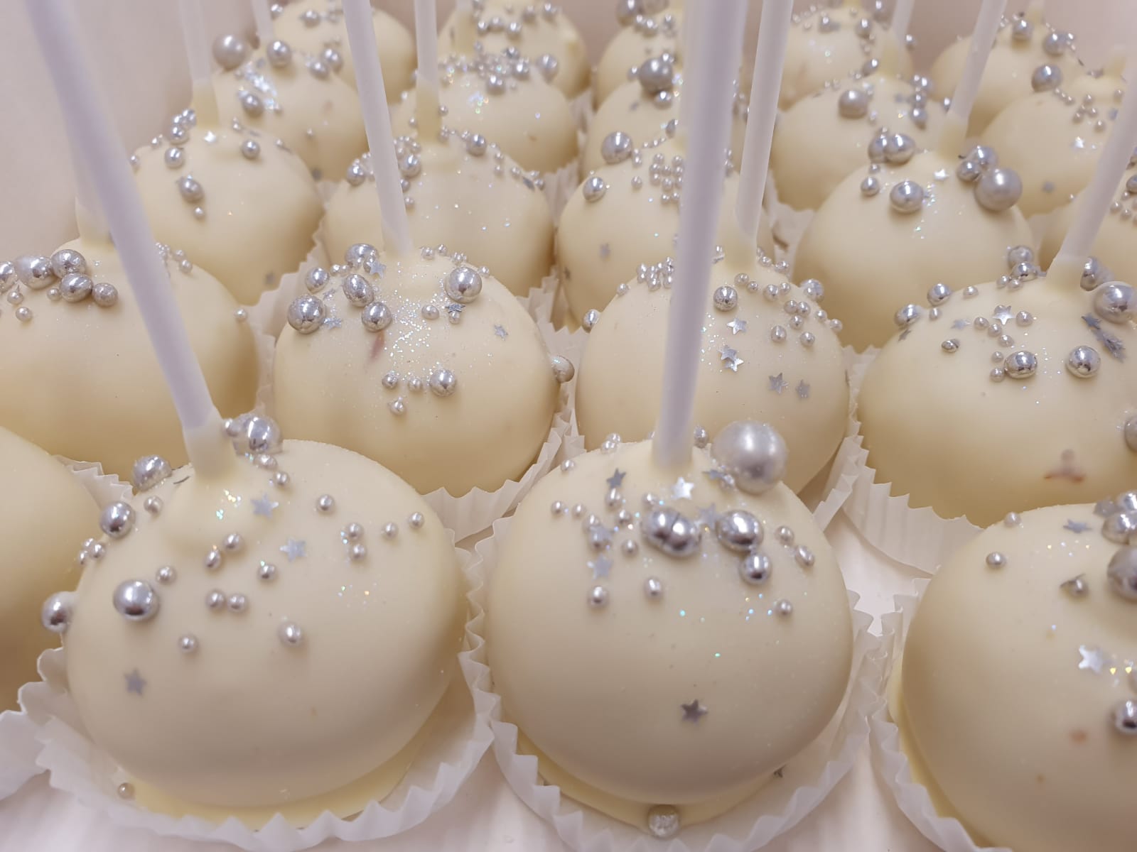 white and silver cake pops Ravens Bakery of Essex Ltd